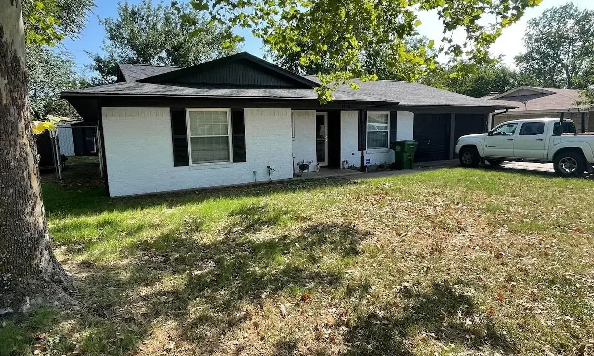 Professional roofing crew working on a residential roof in North Royalton